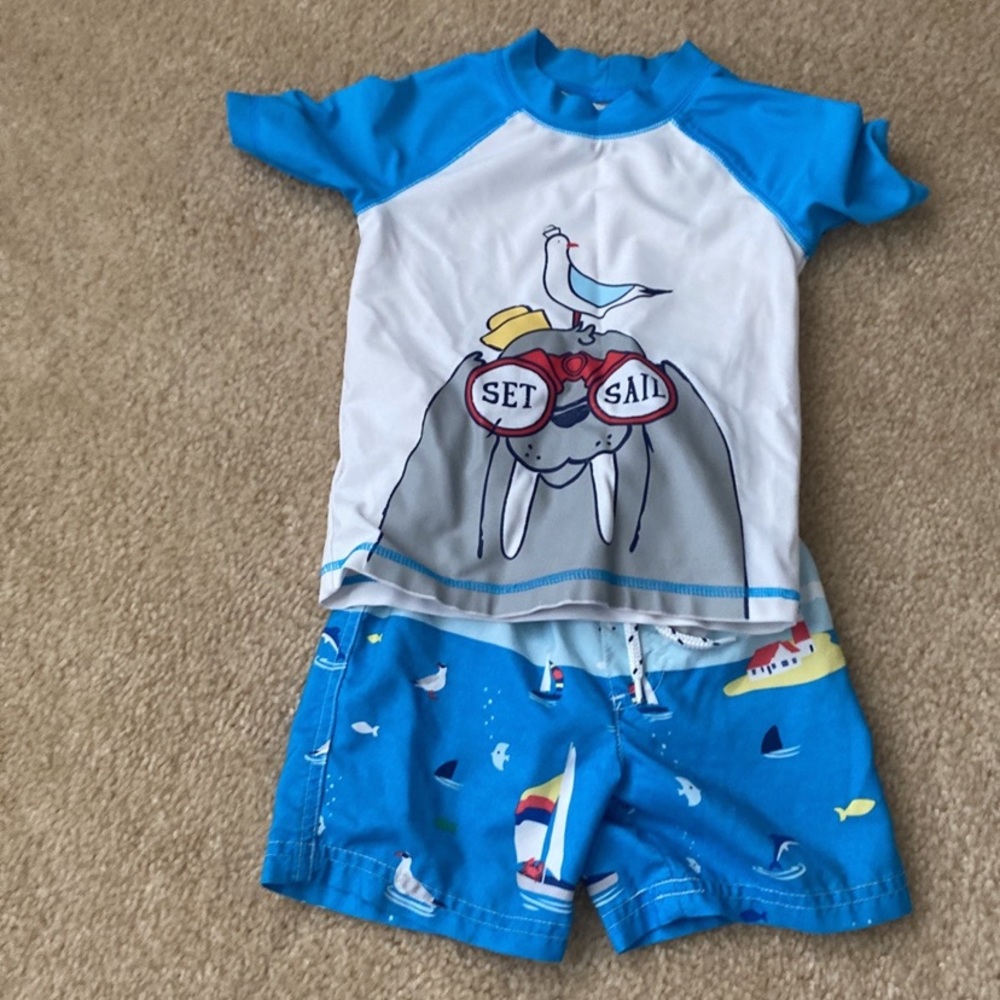 Size 2T Carters brand swim trunks and short sleeve rash guard